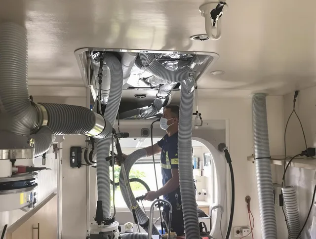 Swampscott Air Duct Cleaning specialist performing precise mobile home duct cleaning in Swampscott