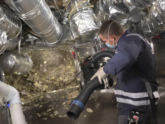 Swampscott Air Duct Cleaning specialist operating negative pressure cleaning equipment for thorough duct maintenance in Swampscott