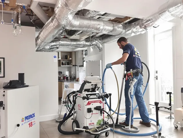 Swampscott Air Duct Cleaning technician performing advanced pure duct cleaning with specialized equipment in Swampscott