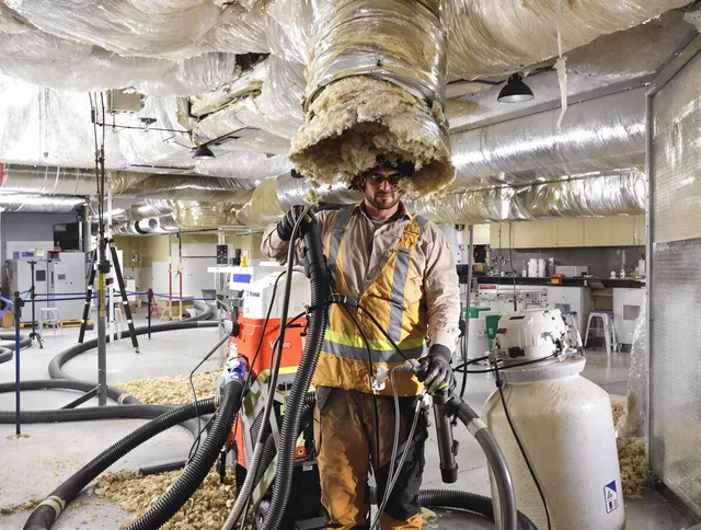 Professional vacuum insulation removal by Swampscott Air Duct Cleaning expert in Swampscott